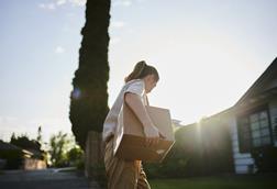 Postal worker delivering parcel