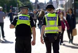 Police officers walking down street