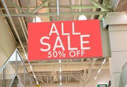 Half price sale sign in store