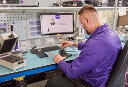 Currys colleague repairing smartphone