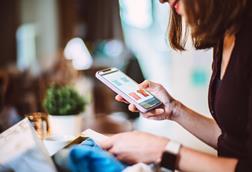 Woman online shopping on her smartphone