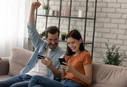 Couple shopping on smartphones