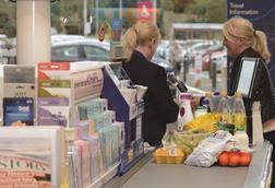 Retail staff working at a check-out