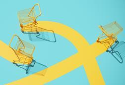 Yellow shopping trolleys on yellow and turquoise background