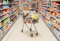 Supermarket-trolley-in-middle-of-supermarket-aisle