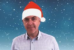 George MacDonald wearing santa hat