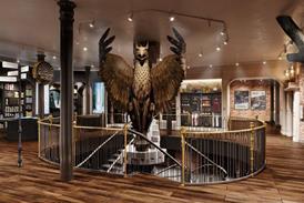 Interior of Harry Potter Store in New York showing a large eagle above a spiral staircase
