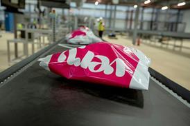 Very branded parcel on a conveyor belt