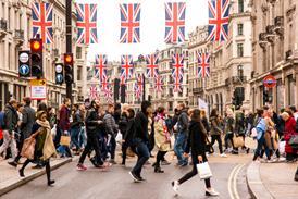 Tourists and shoppers crossing busy Regents Street
