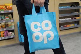 Customer carrying Co-op tote bag
