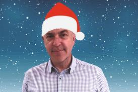 George MacDonald wearing santa hat