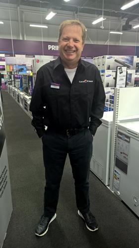 Sir Charles Dunstone dresses for the occasion at a Currys PC World store on Black Friday. 