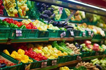 Fresh vegetables on display in supermarket