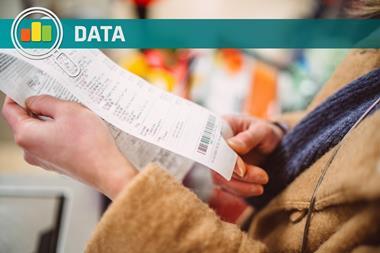Shopper looking at receipt