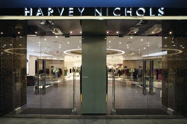Harvey Nichols full year profits fell and sales were flat as the department store chain invested in its store and technology offer