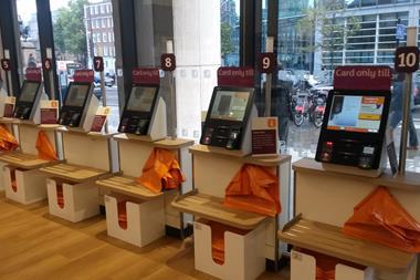 A bank of 'card only' self-service checkouts are located at the front of the store.