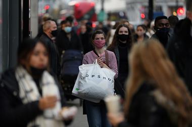 Shoppers on Oxford Street wearing face masks