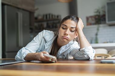 Woman shopping online using mobile device