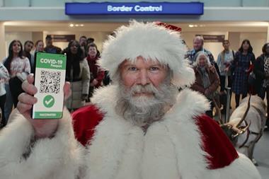 Tesco Christmas ad still showing Santa at border control with a Covid-19 passport app