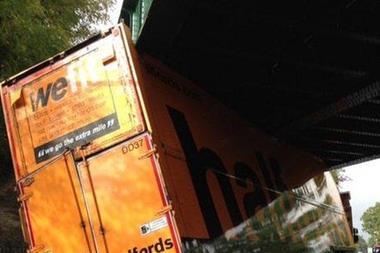 A Halfords lorry got stuck under a low bridge in south-east London