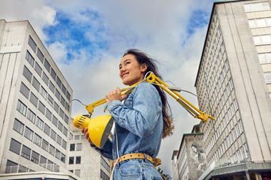 Customer carrying secondhand Ikea lamp