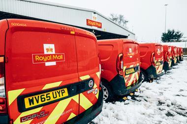 Post vans parked in snow