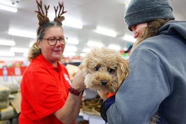 Staff, customer and dog at Jollyes Pets