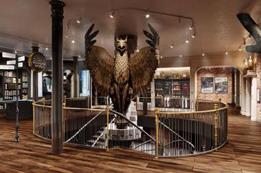 Interior of Harry Potter Store in New York showing a large eagle above a spiral staircase