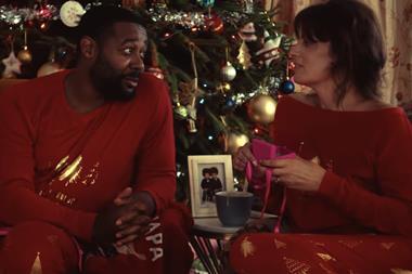 Very Christmas ad 2022 screengrab shows man and woman by a Christmas tree