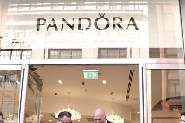 Chief executive Allan Leighton cuts the ribbon of the Pandora store
