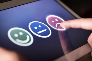 Customer giving feedback on tablet