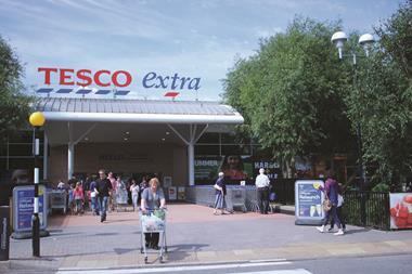 Tesco bosses will hold talks with farmers after protestors accusing the grocer of importing its dairy products blockaded two distribution centres.