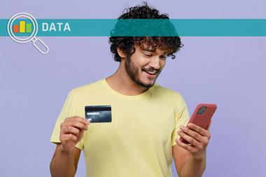 Man holding phone and credit card