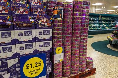 Tins of chocolates in Tesco with labels detailing Clubcard prices
