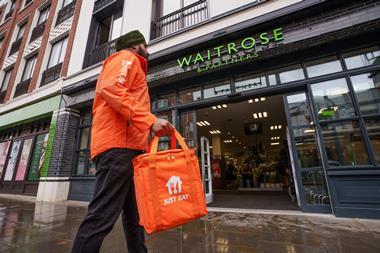 Just Eat delivery person outside a Waitrose store
