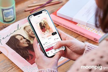 Customer using Moonpig on phone