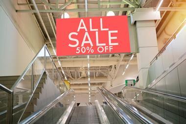 Half price sale sign in store
