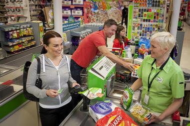 Woman shopping at an Asda checkout