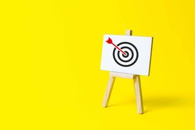 Arrow on a target on a yellow background