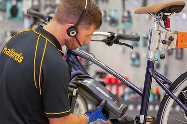 Halfords employee fixing an electric bike
