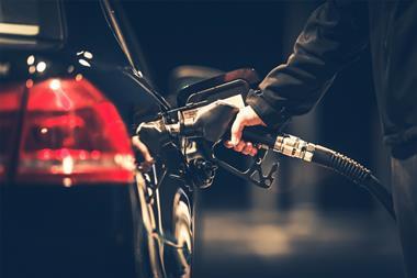 Man filling up car at petrol station