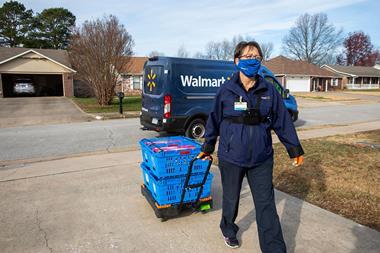 Walmart driver walks up customer's driveway with shopping