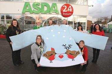 Colleagues at the Asda Bolton store have created what they believe is the UK's biggest Christmas jumper in aid of charity Save the Children.