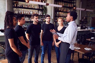 Apprentices being trained in a bar