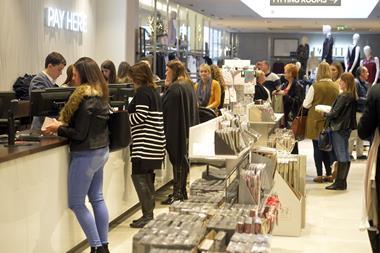 Shoppers  till  cash point  paying