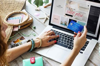 Woman-using-credit-card-to-shop-online-index