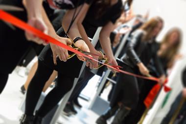 Ribbon being cut on new store