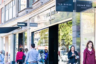 Ted Baker store on street with shoppers walking past