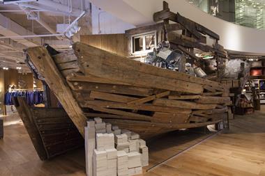 The ground floor features a full-size boat crafted from driftwood
