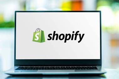 Shopify logo on laptop screen